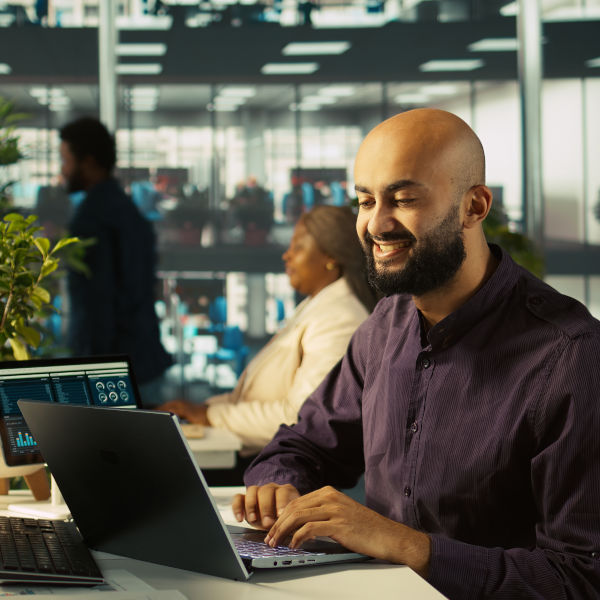 happy man working computer
